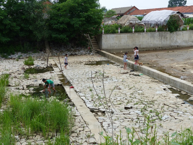 Children playing below the weir