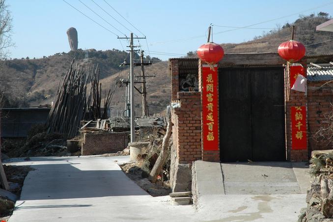 Inside the village with a view of the Hammer Rock