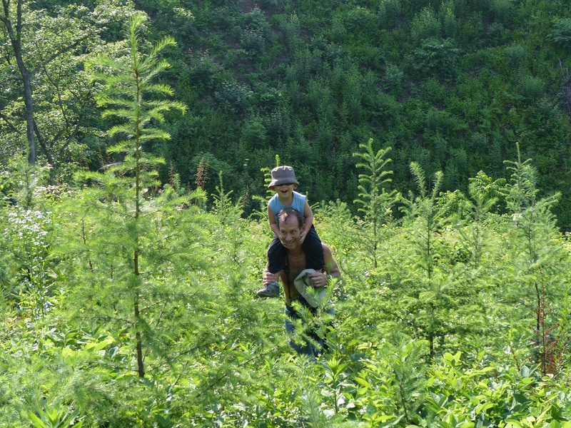 Peter helping Andy up the steep hillside