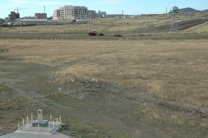 The China-Russian border at Manzhouli - the Chinese border marker and Russian watch tower