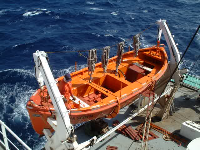 A seaman is giving the lifeboat a fresh touch