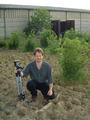 #5: A view to the south west with Mark Pautz crouching over the confluence with his faithful tripod.