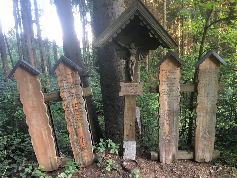 Wooden memorial boards in 120 m distance