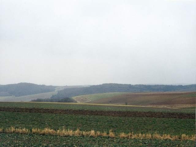 View to the south, the monument is behind the bright patch in the distance where a small tree is visible