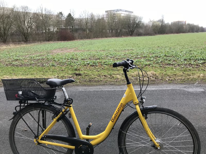 Bicycle mode of transportation to the confluence with site in the background above the back tire.