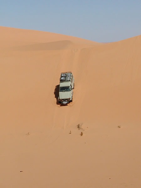 Going down one of the dunes to reach the point