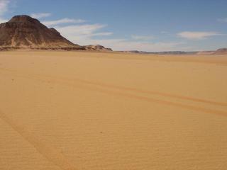 #1: A view of the Confluence from down the wādiy, the Confluence lies to the right of the jabal on the left.