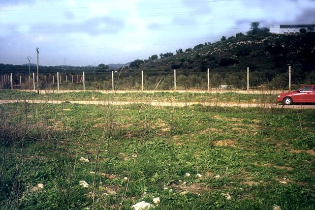 Facing north; pig farm and our rented car