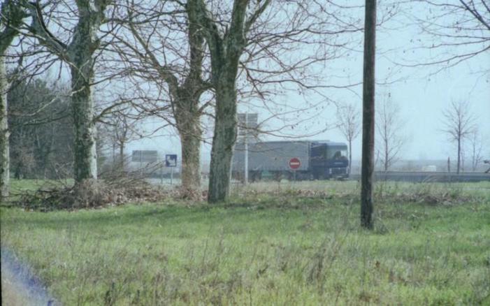 The main road with truck seen to the East