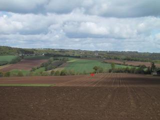 #1: Looking north, from the D 188, towards the spot, showed by the red cross