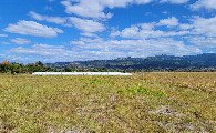 #3: View east, and what I believe to be covered hay bales or some other crop.