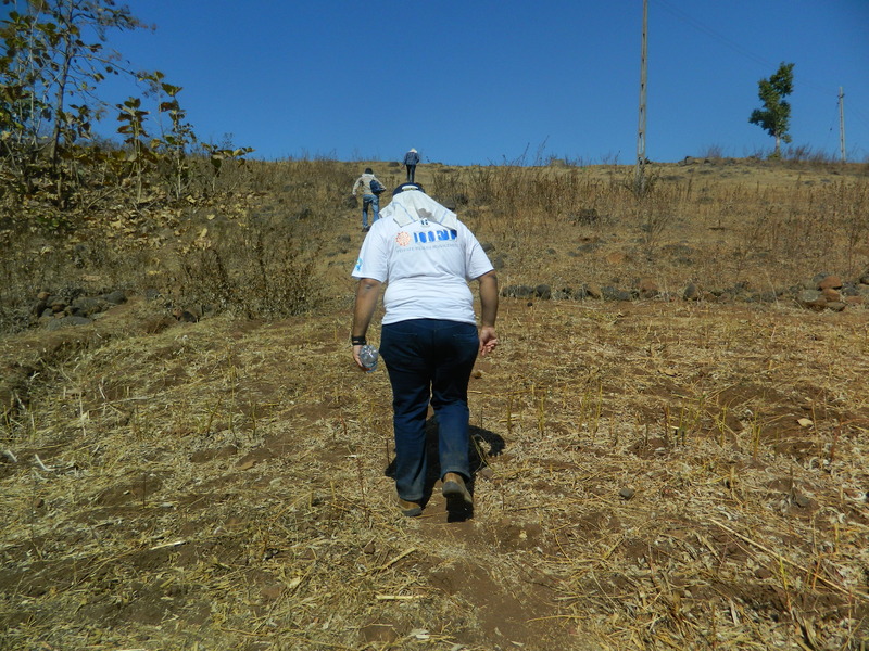 The team ascending one of the hillocks in 34 degree C and scorching sun