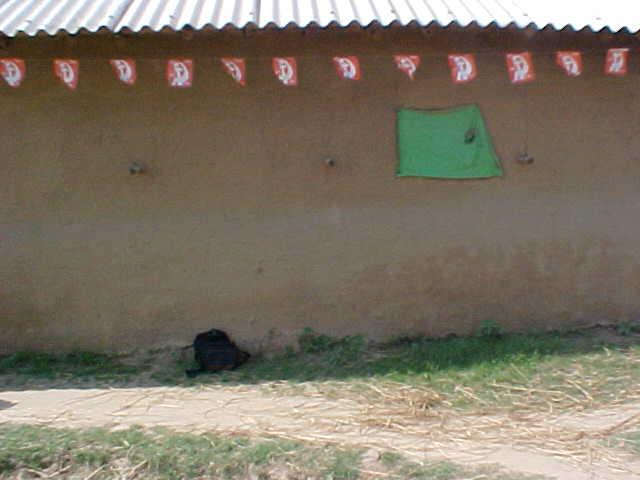 Cardinal South ( A Large hut's Mud Wall)