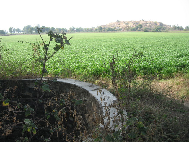 The stone well that sits on the side of the field where the cp lays