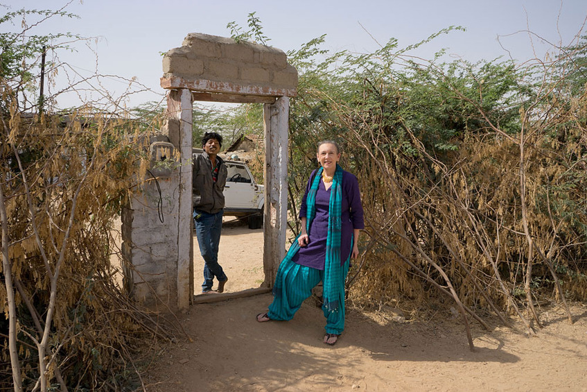 At the entrance to the courtyard: A Luni resident and Candace Whalen