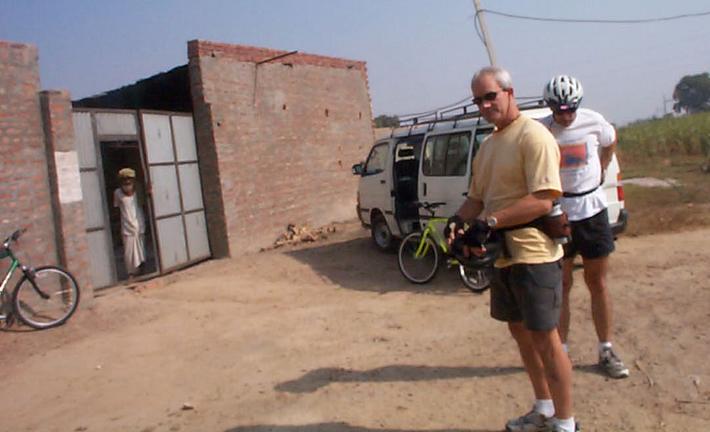 Mark and Steve getting ready to ride.  The man in the doorway lives here, about 800 meters from the confluence.