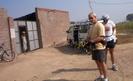 #3: Mark and Steve getting ready to ride.  The man in the doorway lives here, about 800 meters from the confluence.