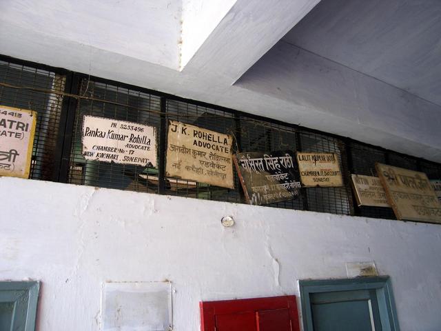 The nearest signage to the confluence point -- the offices of attorneys and advocates in the courthouse