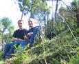 #6: Uwe (Left) and Malcolm sitting with their feet on the confluence