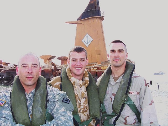 LT Stephen B., CPT Nick D., and LT Scott T. standing in front of 30N 48E