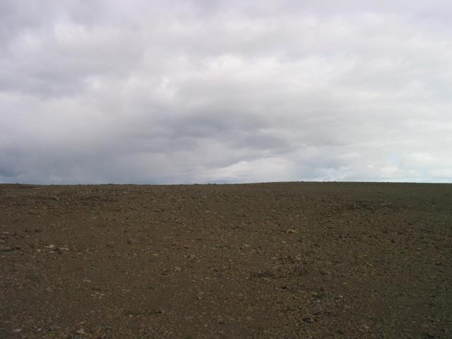 Looking East (more rocks).  There are multicolored hills just over the rise.