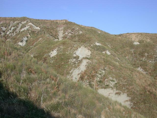 Looking east towards the plateau. The street is just behind the hill.