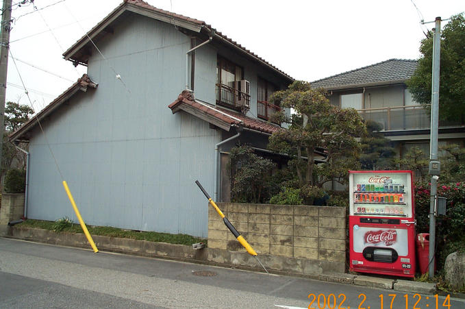 Shows the location, a residence, while looking East.