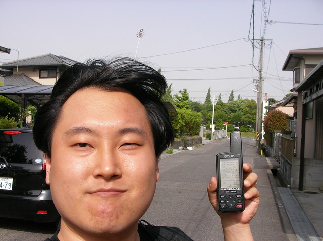 Holding the GPS receiver triumphantly, but winds don't do justice