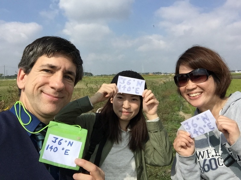 Joseph Kerski, Eri Suzuki, and Masayo Tsuchida feeling centered at the confluence point.