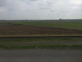 #9: Looking southeast at the confluence in the middle distance, from the levee 610 meters to the northwest of the point.