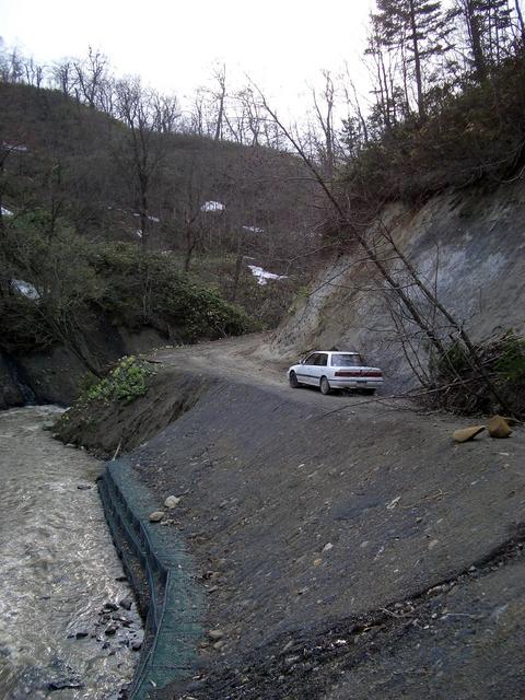 The car neatly backed in at the end of the road for a quick confluence getaway