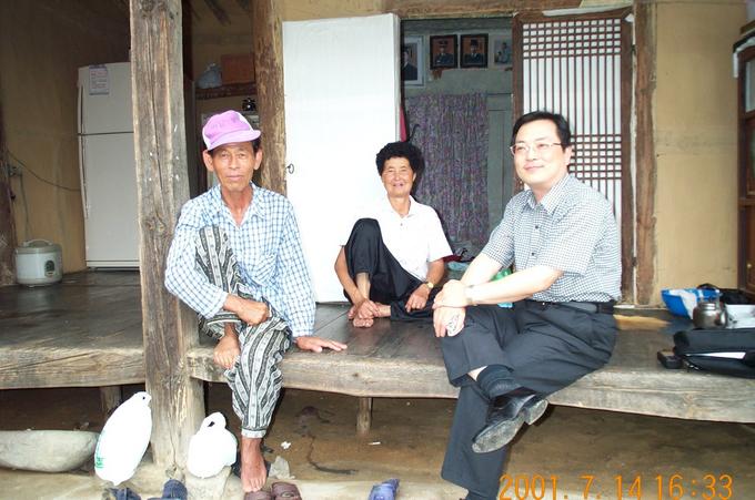 This is my dad on the right, with the kind farmers.