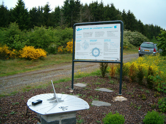 Sundial and sign with my car in the background