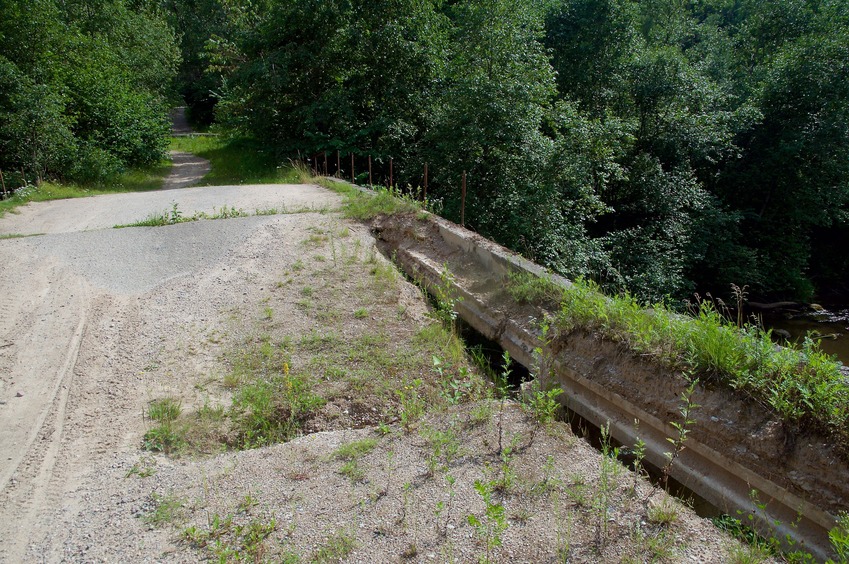 The partially-collapsed bridge across the Riežupe river, about 800 m from the point