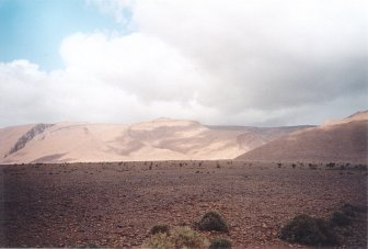 #1: Panorama towards NNW, the Confluence is somewhere behind the mountain range