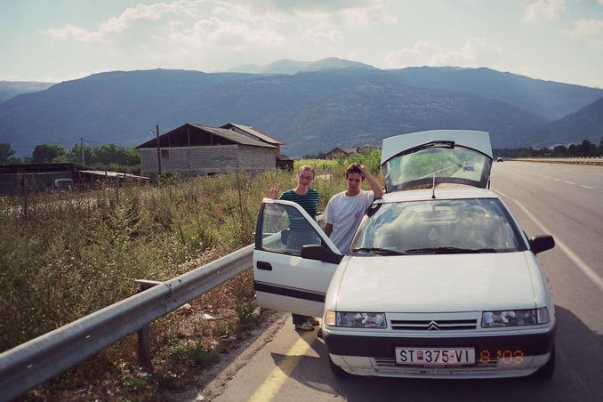 anna and daniel beside the car