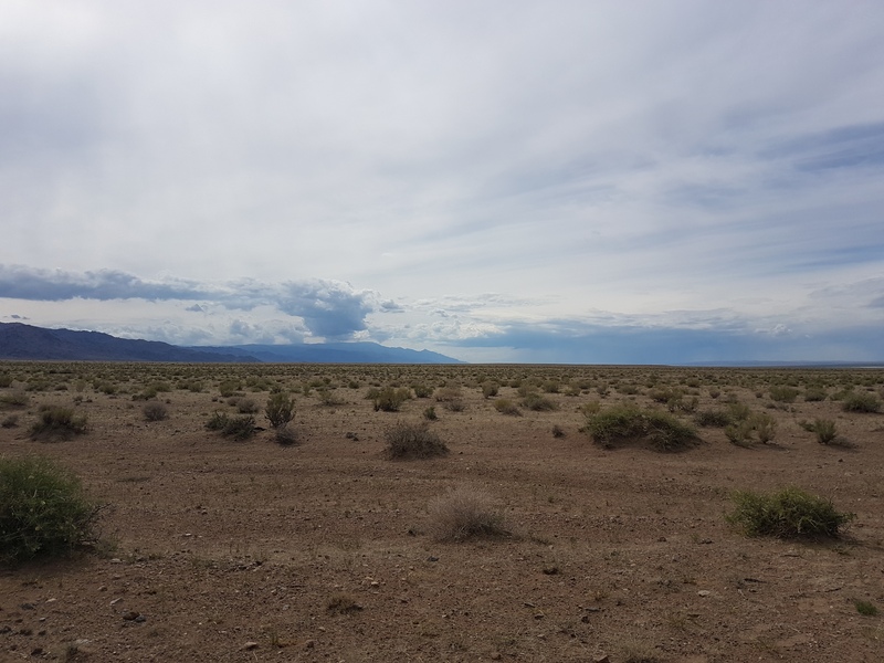 View West: Ikh Bogd Uu Mountain Range at shores of Lake Orog Nuur