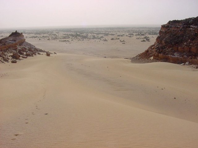 Looking west from the top of the sand glacier, Dirkou in the distance