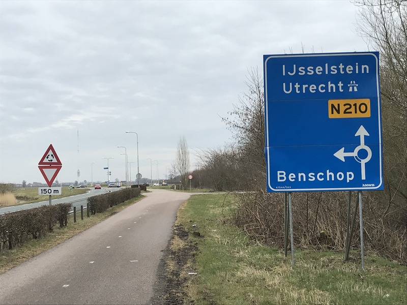 Approaching roundabout where confluence is located, from the west. 