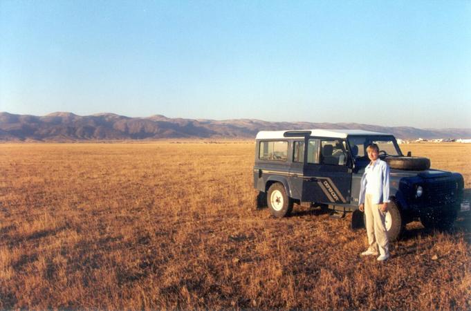 Northeast, Qarrā' mountains in the background, and the edge of the suburb