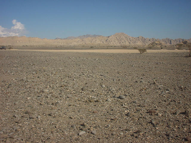 The Confluence in the foreground looking east. The Hajar Mountains in the distance.