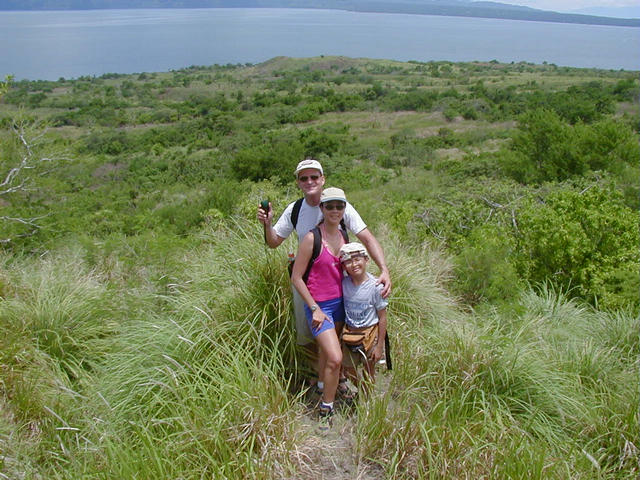 Olma, Kristoff, and Edward 15m (50ft) above the confluence. View Due South. Photo taken by guide Roger Lachica of Talisay, Batangas.