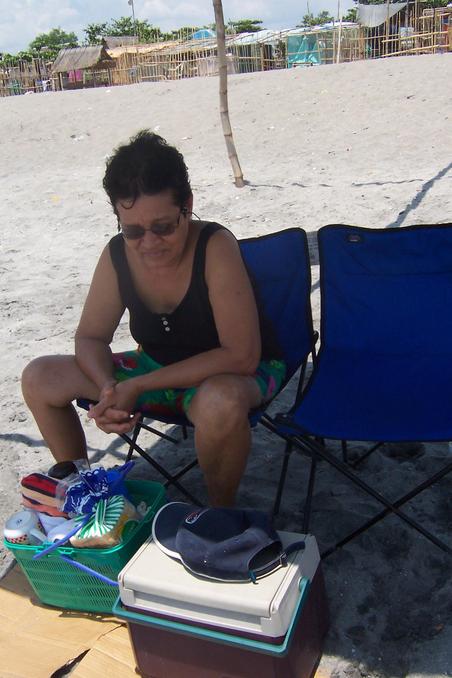 Santah & the makeshift shade at San Narciso Beach