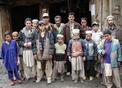 #2: People in a small town on the way up to Shera Kot.  Ali, one of UNJLC's drivers, is in the back.