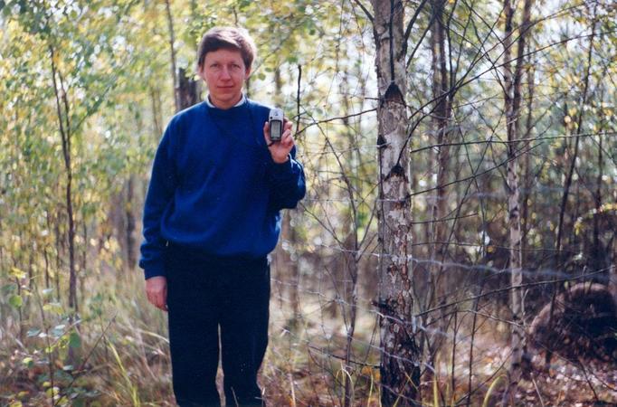 At the fence surrounding the young forest and the confluence