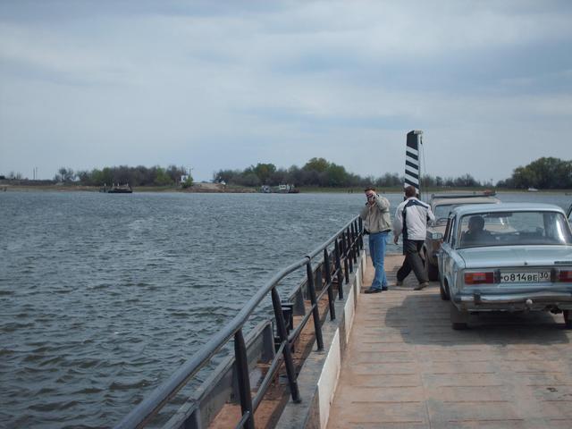 On board ferry, "terminal" visible on opposite bank...