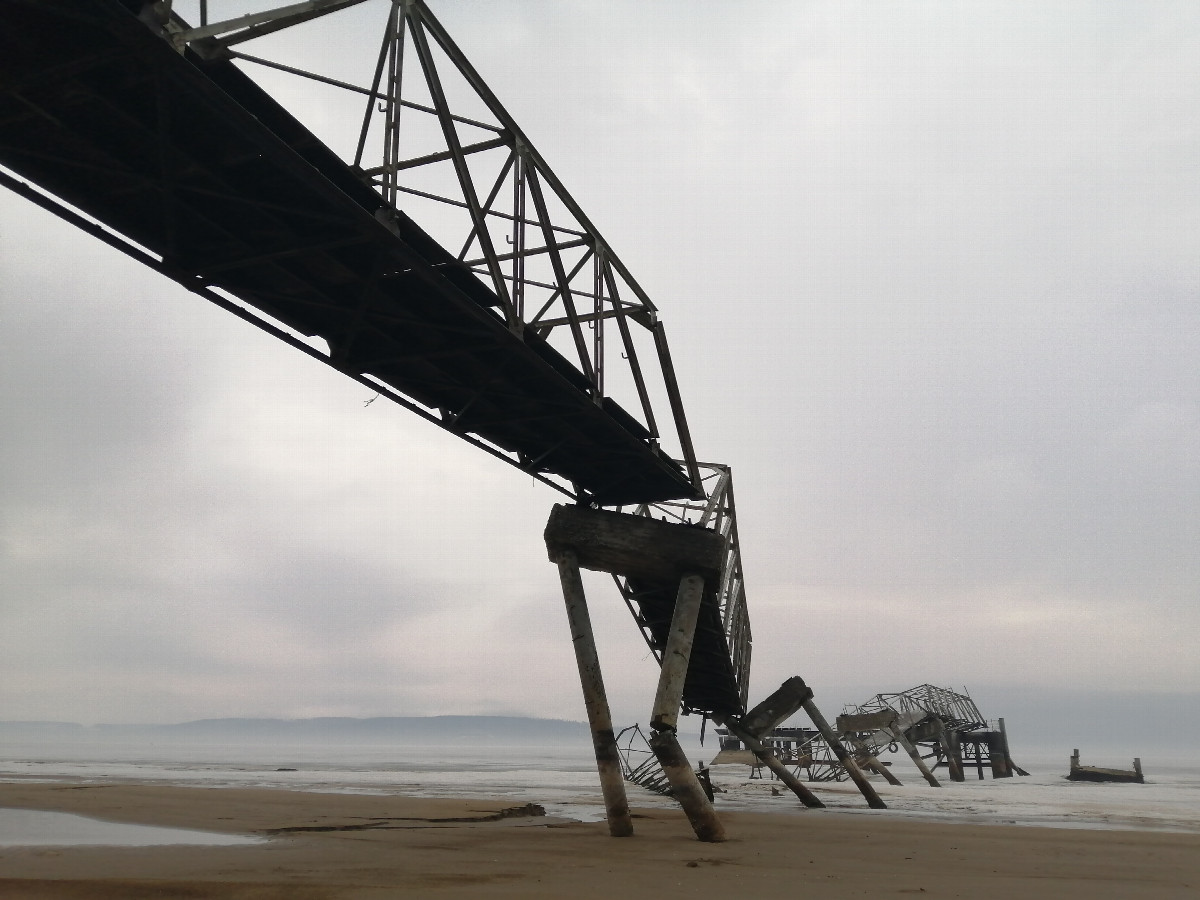 The old destroyed pier on the banks in Belyy Yar