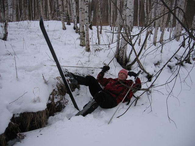 Going to the confluence. Ilia fell down the bed  of frozen stream while descending its steep slope