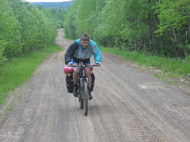 Artem Sismekov at the road that runs as far as 700 metres from the confluence