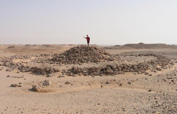 A bronze-age grave within a circle of rocks.